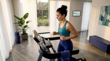 Woman running on treadmill in home gym